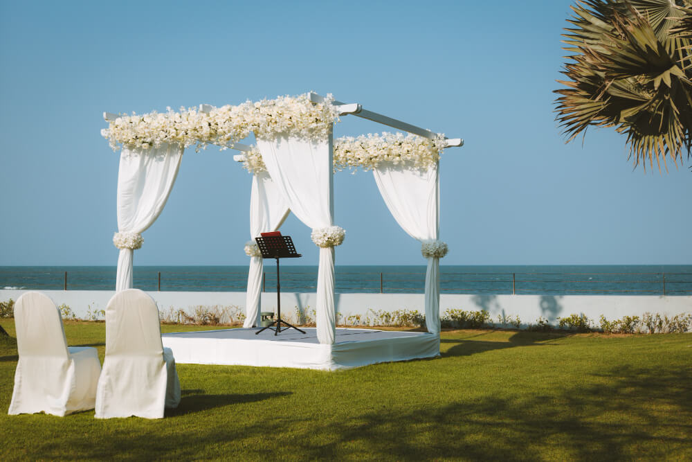 Wedding pavilion set for an outdoor garden wedding by the sea
