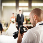 Photographer taking pictures at wedding.