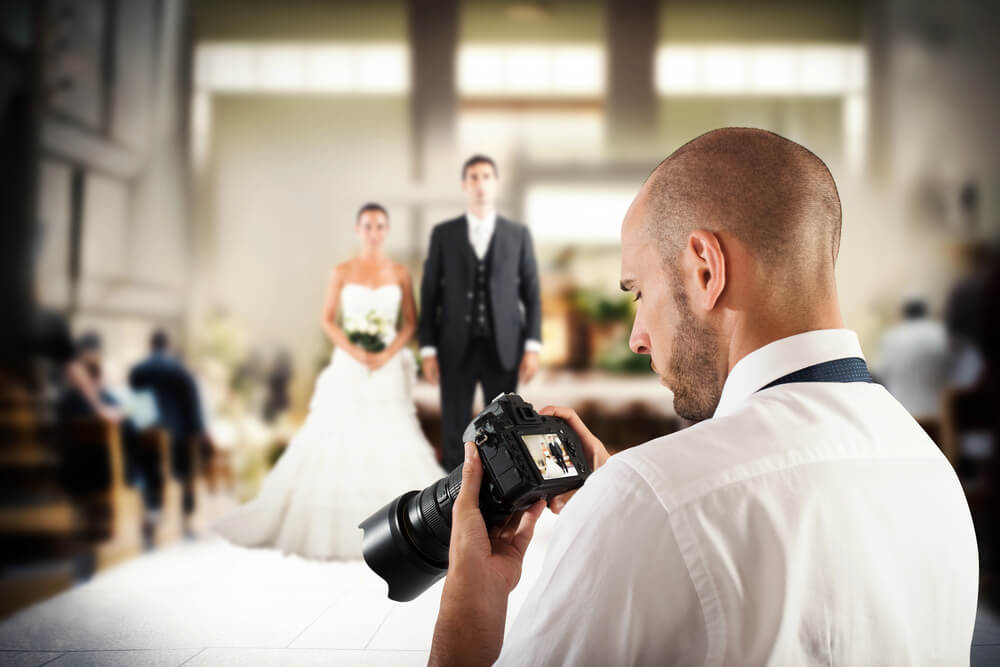 Photographer taking pictures at wedding.