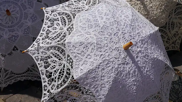 what to do with old wedding dress: umbrella made from wedding lace